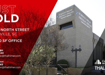 A beige brick office building with vertical windows and the sign SC Governors School for the Arts Foundation is shown. Text announces the 16,000 SF space at 1000 E North St, Greenville, SC as just sold. Agent details are provided.